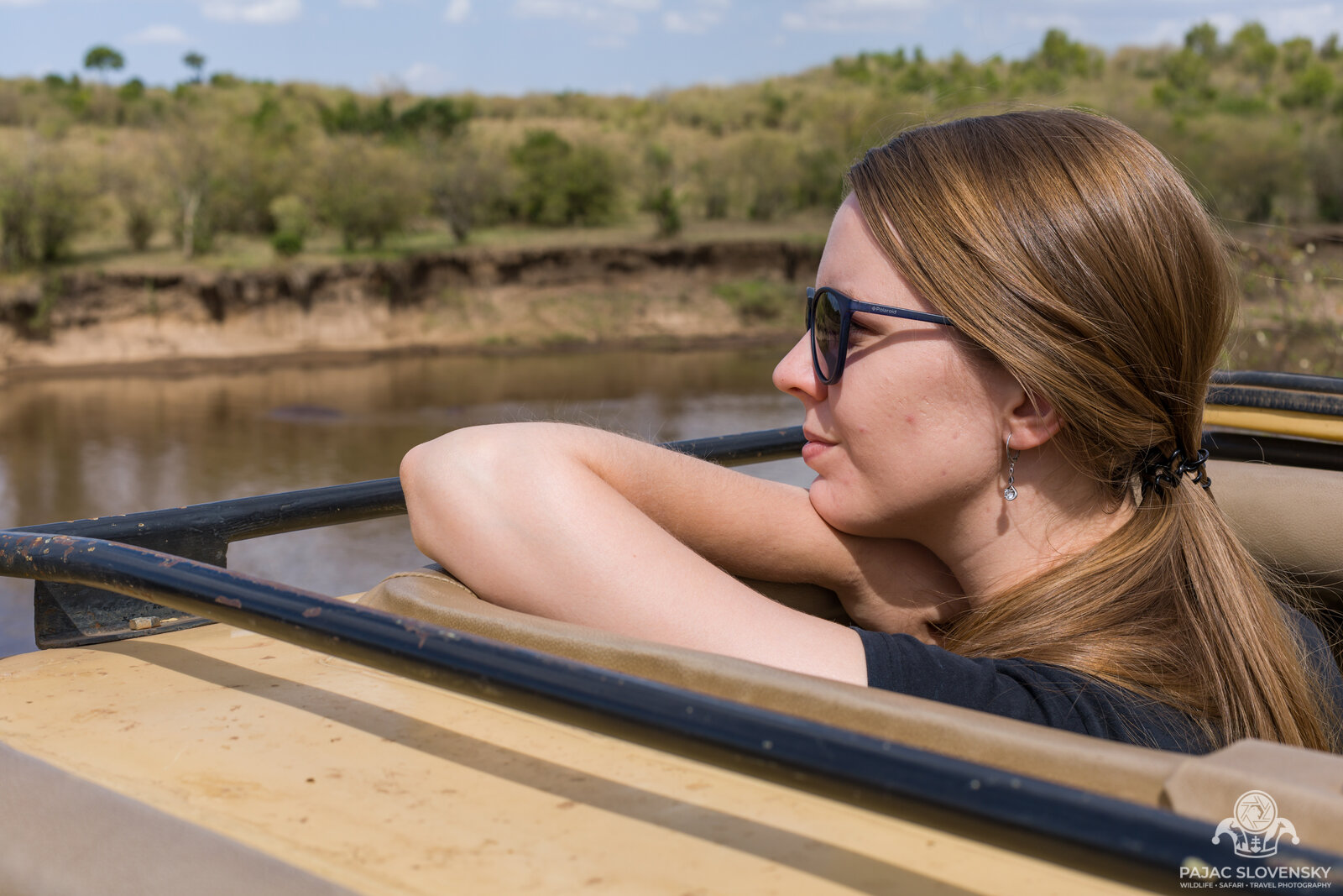 The second photographer watching the Mara River from the safari vehicle