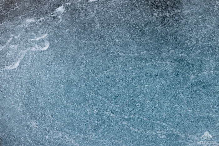 Abstract braids of silt-laden glacial water