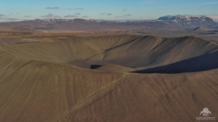 Aerial of Hverfjall's vast grey tephra crater ring above the Mývatn plain