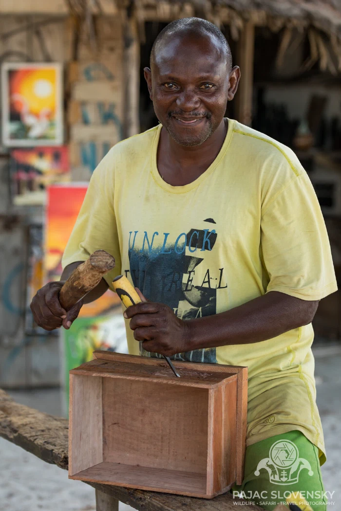 The craftsman's smile, chest in hand