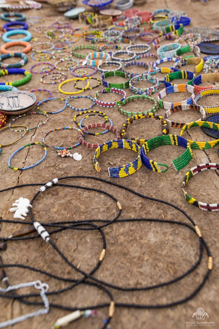 Beaded bracelets and long bead necklaces arranged for sale, close detail