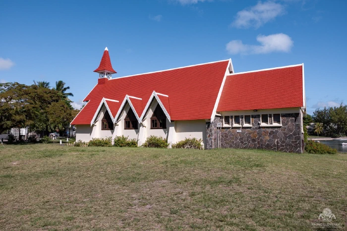 Cap Malheureux church with its red roof and bell tower under blue sky