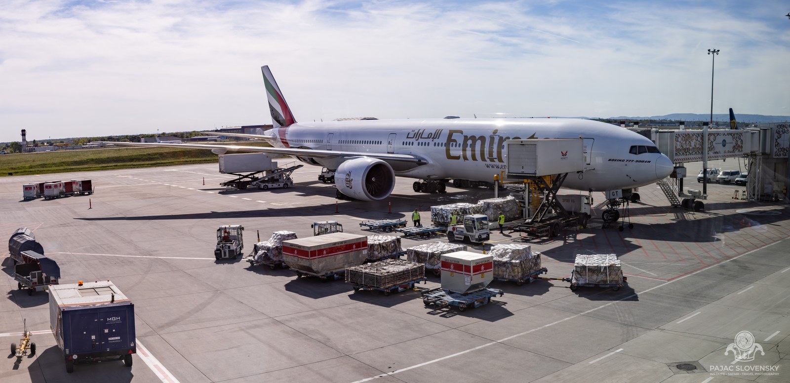 Emirates Boeing 777 loading on the stand at Mauritius airport