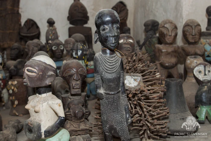 Carved wooden figures gathered in a curio shop
